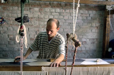 An artisan in the Nile Delta village of Fowwa works on a kilim piece, a traditional Egyptian form of weaving. Courtesy of Kiliim