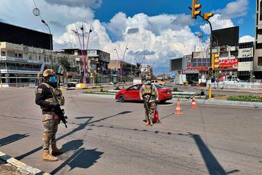 Security forces are deployed to enforce a curfew in central Baghdad, Iraq, last week. AP Photo