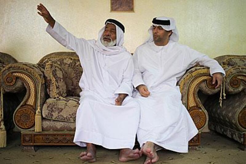 Sheikh Shaiban bin Mohammed, of the Habus tribe, left, speaks in the Shehhi dialect of the northern cape of the UAE.