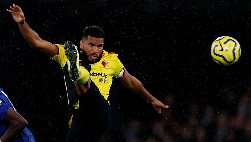 (FILES) In this file photo taken on November 02, 2019 Watford's English-born Jamaican defender Adrian Mariappa (R) controls the ball during the English Premier League football match between Watford and Chelsea at Vicarage Road Stadium in Watford, north of London. Watford defender Adrian Mariappa said news that he had tested positive on May 20, 2020, for the coronavirus COVID-19, came as a "big surprise" as he has felt no ill effects. The 33-year-old was one of three positive tests at Watford with the other two among staff members.
 - RESTRICTED TO EDITORIAL USE. No use with unauthorized audio, video, data, fixture lists, club/league logos or 'live' services. Online in-match use limited to 120 images. An additional 40 images may be used in extra time. No video emulation. Social media in-match use limited to 120 images. An additional 40 images may be used in extra time. No use in betting publications, games or single club/league/player publications.
 / AFP / Adrian DENNIS / RESTRICTED TO EDITORIAL USE. No use with unauthorized audio, video, data, fixture lists, club/league logos or 'live' services. Online in-match use limited to 120 images. An additional 40 images may be used in extra time. No video emulation. Social media in-match use limited to 120 images. An additional 40 images may be used in extra time. No use in betting publications, games or single club/league/player publications.
