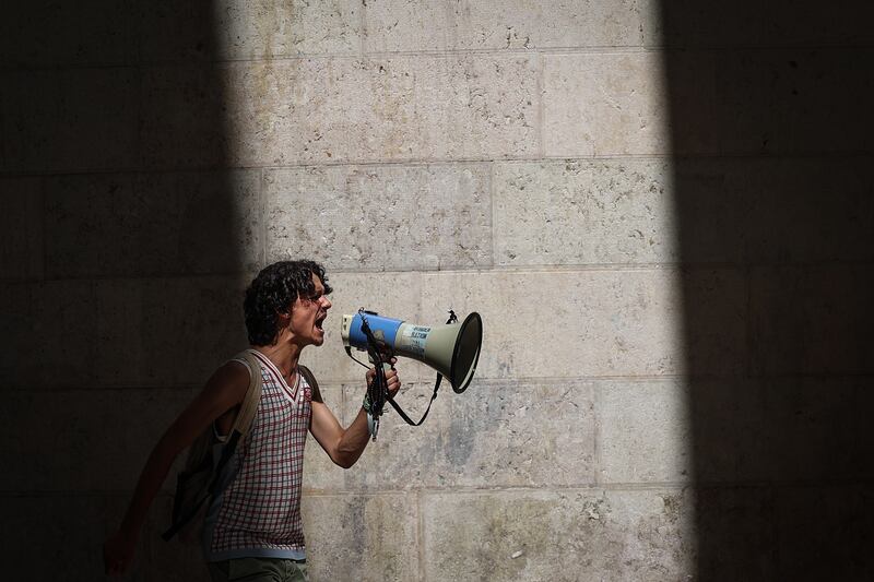 A student sounds off at the Global Climate Strike rally of Fridays for Future in Lisbon, Portugal. EPA