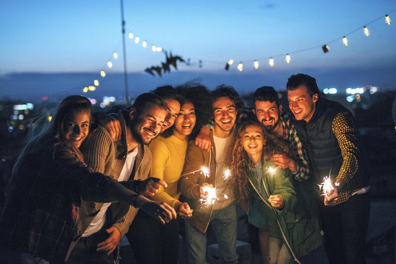 A group of friends celebrating the New Year on the roof.