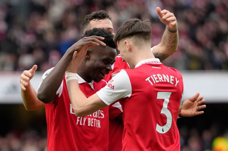Bukayo Saka (L) celebrates with teammates after scoring Arsenal's fourth goal in the 4-1 Premier League win against Crystal Palace at Emirates stadium on March 19, 2023. AP