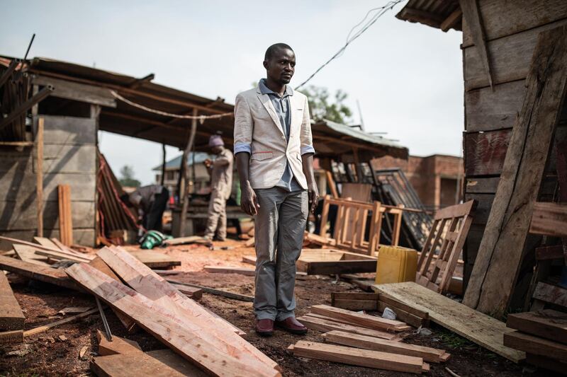 Jeannot, 28-years-old, Ebola virus survivor and deputy manager at a carpentry shop is seen inside the grouds of his workshop in Beni, north eastern Democratic Republic of the Congo on September 17, 2019.  Jeannot lost his wife to ebola and now also works inside the Ebola Treatment Centres (ETC) directly with the patients as he is now immune to Ebola. Since the beginning of the Ebola epidemic in  August 2018 there has been over two thousands deaths and now nearly 1000 survivors. / AFP / JOHN WESSELS
