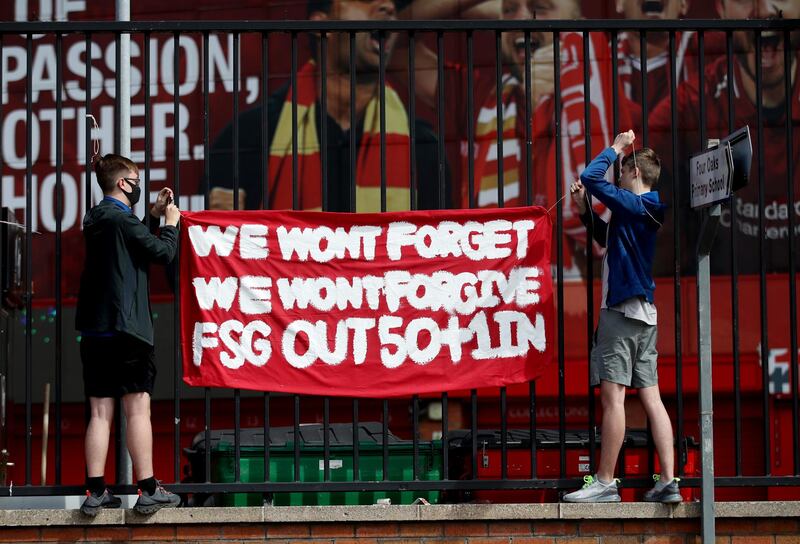 Liverpool fans put up a banner during the protest against American owners Fenway Sports Group over the aborted Super League project at Anfield. Reuters