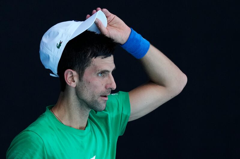 Defending Novak Djokovic practices on Margaret Court Arena. AP