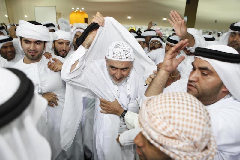 Ahmed Al Amash, celebrates his FNC election victory with his supporters in Ras Al Khaimah City in 2011. His supporters look forward to voting for him again if he runs for a second term on the council. Antonie Robertson / The National