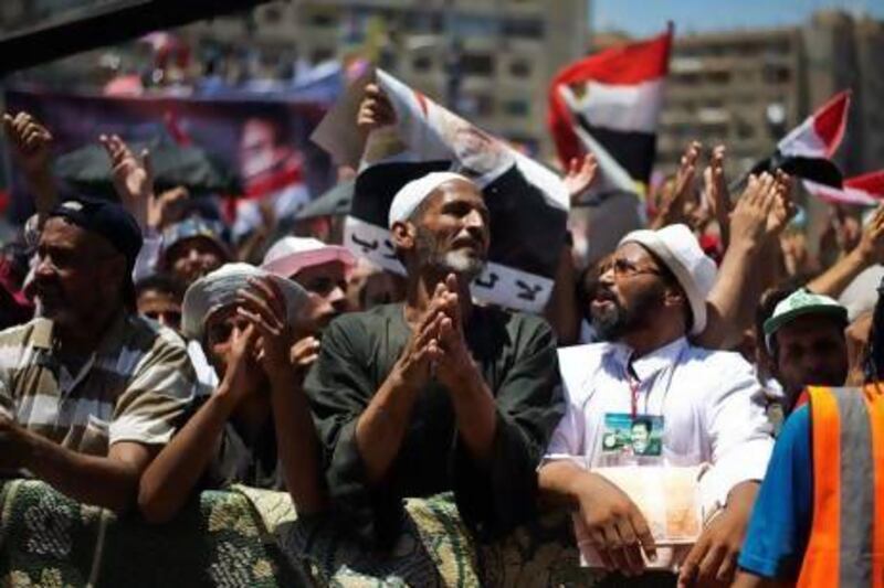 Muslim Brotherhood members and supporters of Mohammed Morsi outside the Rabaah Al Adawiya mosque on the first day of Eid Al Fitr.