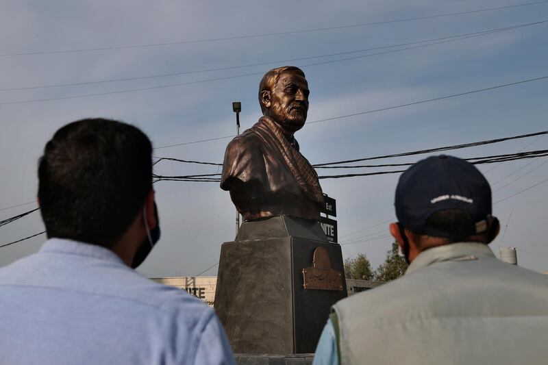 Hezbollah supporters look at a statue of Iranian general Qassem Suleimani, head of Iran's Quds force, installed in Ghobeiry, a southern suburb of Beirut, Lebanon, to commemorate the first anniversary of his killing in a US drone strike in Baghdad. AP Photo