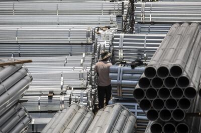 Steel tubing in a stock yard in Shanghai. Factory output in China has slowed amid weak external and domestic demand. Bloomberg