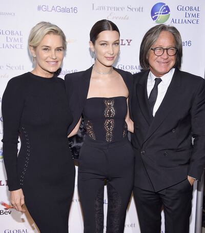 Bella Hadid, centre, with her mother Yolanda Hadid and father Mohamed Hadid in 2016. Getty Images