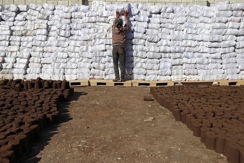 The waste that remains after the olives are pressed to make oil is gathered, shaped into pipes, cut and then sun-dried.