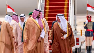 Bahrain's Crown Prince and Prime Minister Salman bin Hamad al-Khalifa, right, receiving Saudi Arabia's Crown Prince Mohammed bin Salman, centre left, in Manama on Thursday ahead of the 33rd Arab League Summit. Bahrain News Agency via AFP