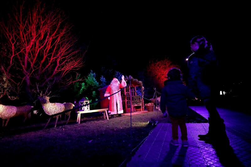 Santa Claus greets guests at Kew Gardens in London, England. Getty Images