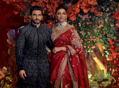 Actor Ranveer Singh and his wife, actress Deepika Padukone, at the party. Reuters