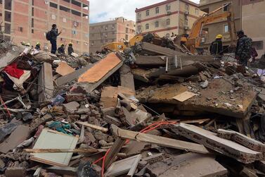 Emergency workers sift through the rubble of a collapsed apartment building in the El Salam neighbourhood, Saturday, March 27, 2021, in Cairo. AP Photo