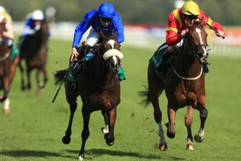 Certify (left) ridden by Michael Barzalona beats Purr Along to win The Barrett Steel May Hill Stakes during the Ladbrokes St Leger Festival at Doncaster Racecourse.