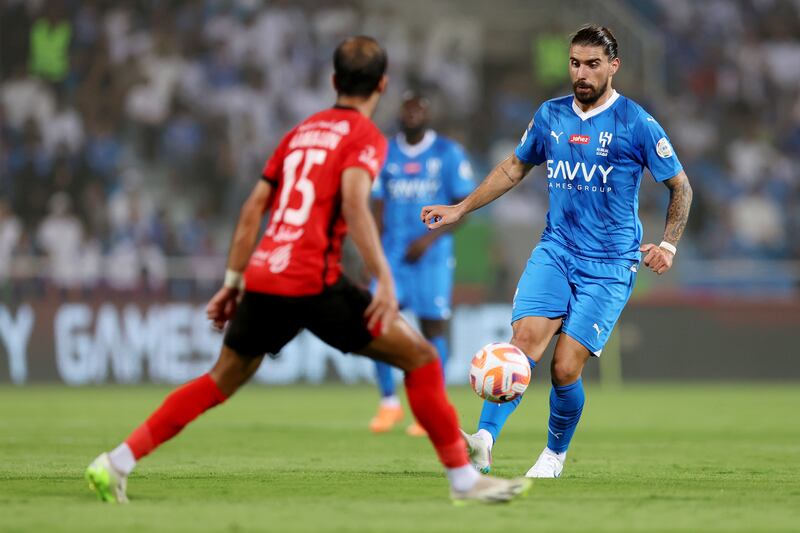 Al Hilal midfielder Ruben Neves under pressure from Abdulhadi Al-Harajin of Al Riyadh. Getty