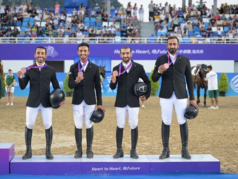 The UAE show jumping team on the podium after winning bronze at the Asian Games in Hangzhou on Wednesday, October 4, 2023. Photo: Kamel Abdalla