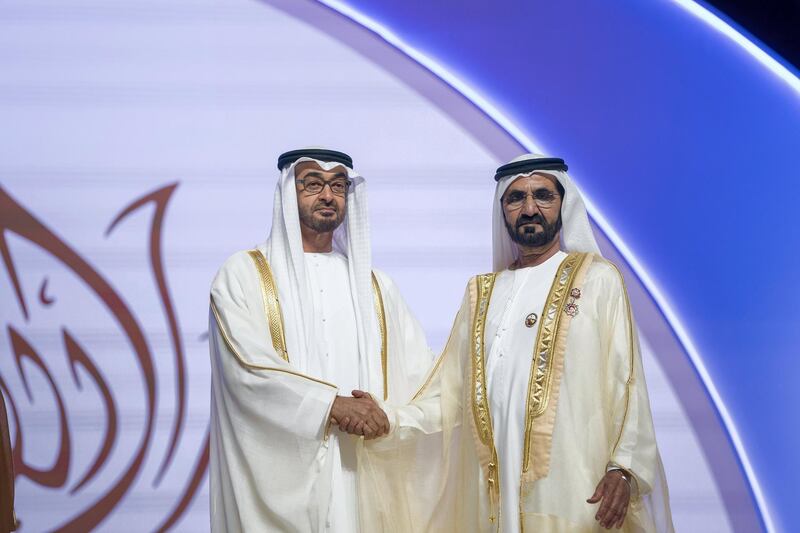 ABU DHABI, UNITED ARAB EMIRATES - November 22, 2017: HH Sheikh Mohamed bin Zayed Al Nahyan, Crown Prince of Abu Dhabi and Deputy Supreme Commander of the UAE Armed Forces (L) presents the Order of the Mother of the Nation to HH Sheikh Mohamed bin Rashid Al Maktoum, Vice-President, Prime Minister of the UAE, Ruler of Dubai and Minister of Defence (R), during the HH Sheikha Fatima bint Mubarak Awards for Excellence and Social Creativity, at Emirates Palace.

( Mohamed Al Hammadi / Crown Prince Court - Abu Dhabi )
---
