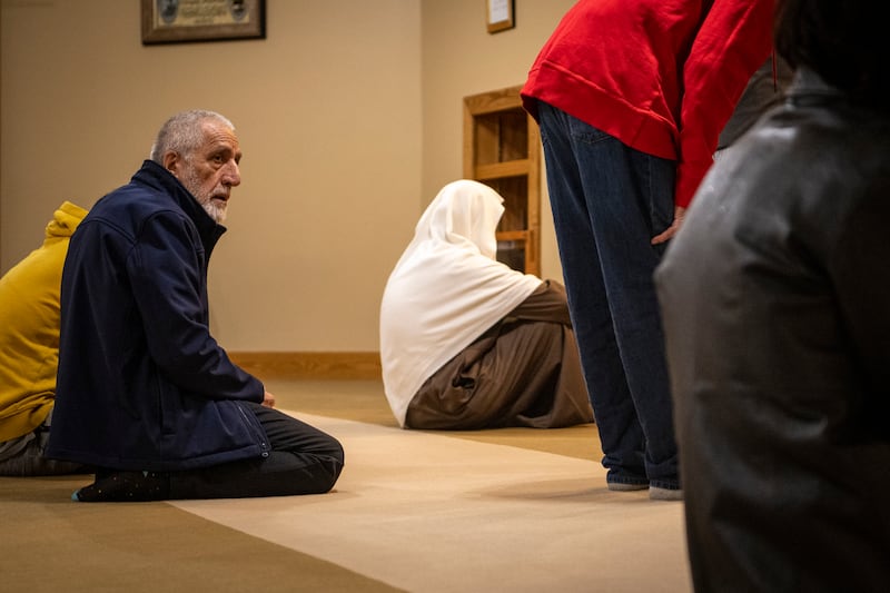 Bahrami's husband, Mohammad Saber Bahrami, participates in prayers at the mosque. AP Photo