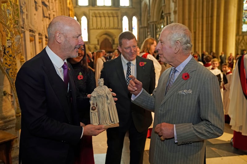 King Charles is presented with a maquette of the statue. Getty Images