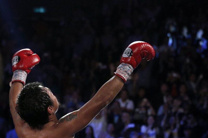 "I'm so happy," Manny Pacquiao said on Sunday, "because my time is not over." Tyrone Siu / Reuters