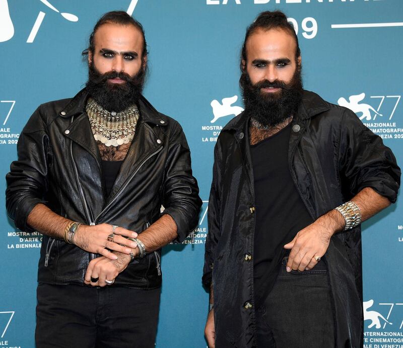 Palestinian filmmakers Tarzan and Arab Nasser pose at a photocall for 'Gaza Mon Amour ' at the 77th Venice International Film Festival on September 4, 2020. EPA