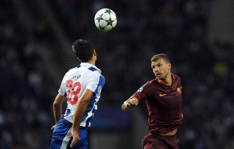 Porto's Felipe, left, and Roma's Edin Dzeko. Paulo Duarte / AP Photo / August 17, 2016 