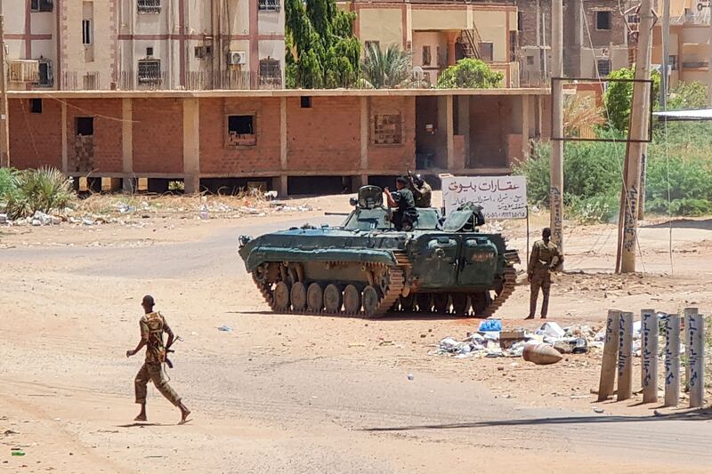 Army sodliers and tanks on a street in Khartoum. AFP

