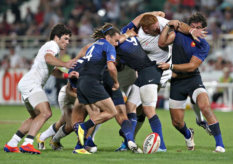 Dubai , United Arab Emirates, Dec 2 2011-England v France- Englands front line over powering a scrum during action at the Emirates Airlenes Dubai Rugby Sevens. Mike Young / The National
