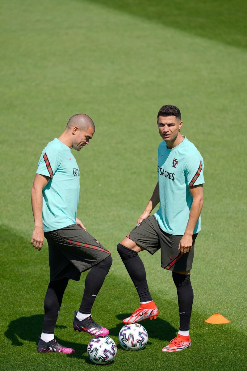 Portugal's players Pepe, left, and Cristiano Ronaldo. EPA