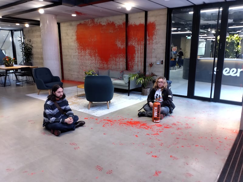 Youth Demand supporters sitting in Labour's headquarters after daubing the building with red paint. Reuters