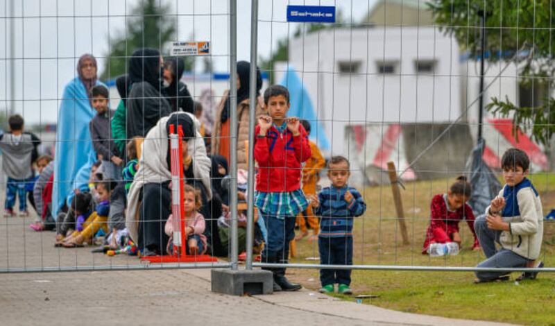 Recently-arrived refugees from Afghanistan are seen at a camp at the US Army's Rhine Ordnance Barracks, where they are being temporarily housed,  in Kaiserslautern, Germany. Getty Images
