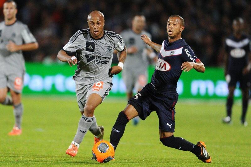 Andre Ayew, left, dring a Ligue 1 match with Marseille. Nicolas Tucat / AFP