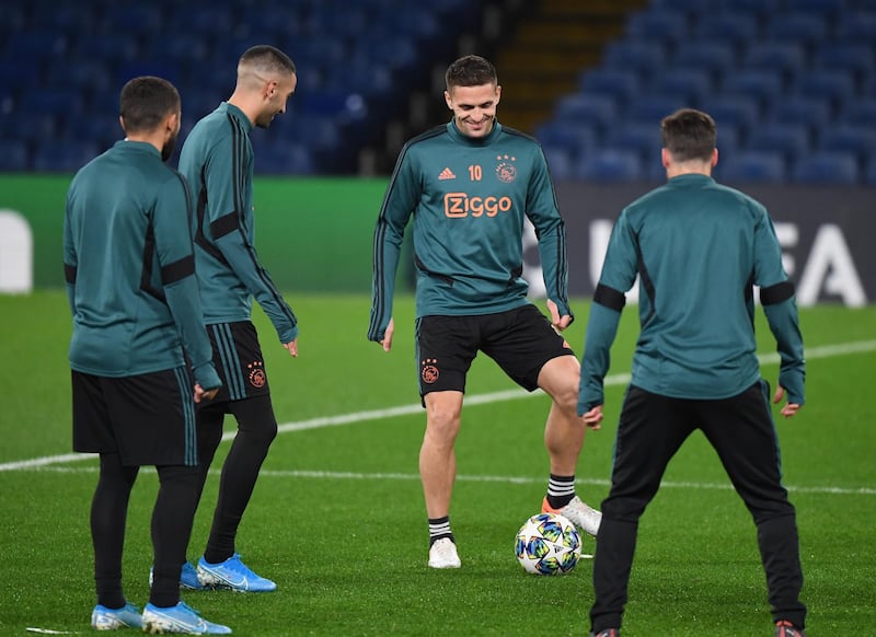 Dusan Tadic, centre, takes part in a training session at Stamford Bridge ahead of the Champions League match against Chelsea.