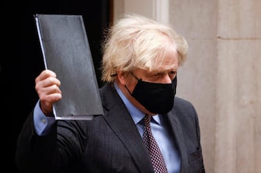 Prime Minister Boris Johnson leaves Downing Street in London before announcing his road map for easing lockdown. Reuters 
