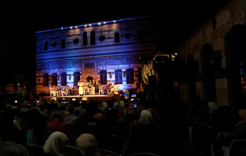 The Sultans of Tarab perform at the ancient palace of Damascus. EPA