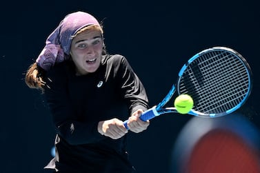 This handout picture released by the Tennis Australia shows Meshkatolzahra Safi of Iran hits a return as she competes during a girls doubles match on day eight of the Australian Open tennis tournament in Melbourne on January 24, 2022.  (Photo by Morgan Hancock  /  TENNIS AUSTRALIA  /  AFP)  /  XGTY  /  RESTRICTED TO EDITORIAL USE - MANDATORY CREDIT "AFP PHOTO  /  TENNIS AUSTRALIA  /  MORGAN HANCOCK " - NO MARKETING NO ADVERTISING CAMPAIGNS - DISTRIBUTED AS A SERVICE TO CLIENTS