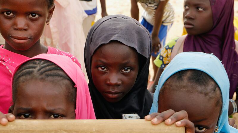 Displaced children attend class in Dori town, Burkina Faso. Violent insurgencies in the central Sahel region of Africa continued to drive internal displacement, particularly in Burkina Faso. AP
