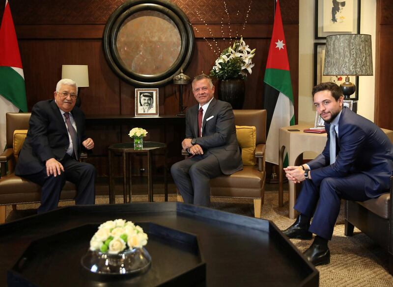 Jordan's King Abdullah II (C) and his son, Crown Prince Hussein (R), meet with Palestinian president Mahmoud Abbas (L) at the Royal Palace in Amman, Jordan August 8, 2018. Khalil Mazraawi/Pool via REUTERS