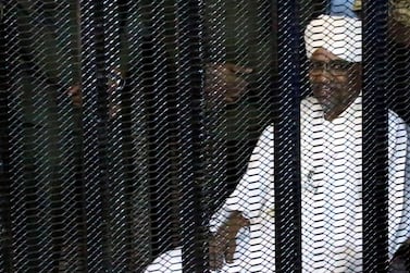 Sudan's former president Omar Al Bashir sits in a cage at the courthouse in Khartoum where he is facing corruption charges on August 19, 2019. Reuters