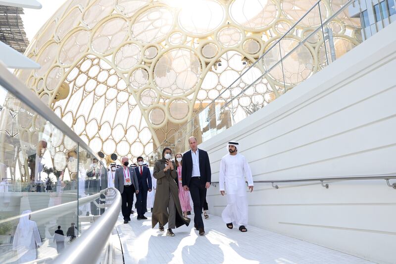 Sheikh Hamdan bin Mohammed, right, and Noura Al Kaabi, Minister of Culture and Youth, accompany Prince William on the tour. Getty