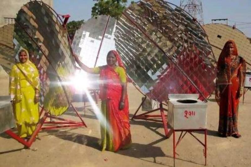 Barefoot College women with their solar cookers. The lady in red is Norti Devi, who has been building the cookers for six years.