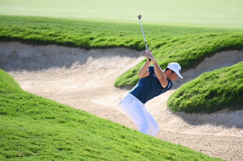 Viktor Hovland plays his second shot on the 10th hole. Getty