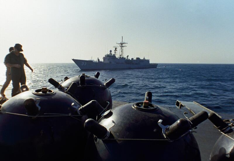 FILE - This Sept. 21, 1987 file photo shows mines aboard the Iranian ship Iran Ajr being inspected by a boarding party from the USS Lasalle in the Persian Gulf. Mysterious attacks on oil tankers near the strategic Strait of Hormuz show how susceptible one of the world's crucial chokepoints for global energy supplies remains, 30 years after the U.S. Navy and Iran found themselves entangled a similarly shadowy conflict. (AP Photo/Mark Duncan, File)