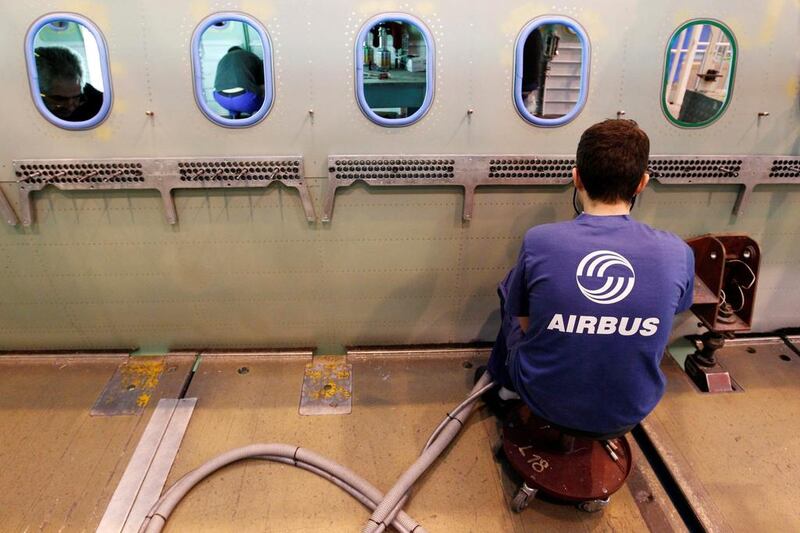 An Airbus employee works in a fuselage section of an A320 Airbus at the Airbus facility in Montoir-de-Bretagne near Saint-Nazaire, France. The company has been unified as one entity. Stephane Mahe / TPX 