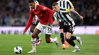 Newcastle United, playing in black and white, have come under Saudi control as Riyadh steps up its interests in the UK's north-east region. Getty Images