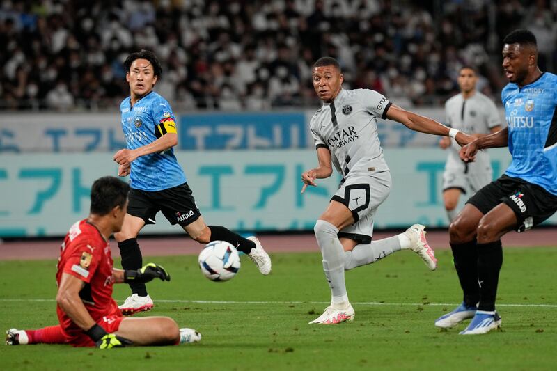 PSG's Kylian Mbappe sees his shot saved by Kawasaki Flontale goalkeeper Jung Sung-ryong. AP