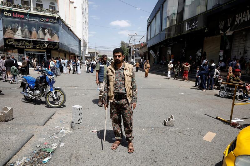 epa09251023 Pro-Houthi soldiers stand guard during an anti-US and Saudi rally at a street, amid diplomatic efforts to persuade Houthi leaders to accept a nationwide ceasefire, in Sana’a, Yemen, 06 June 2021. US, UN and Omani diplomatic efforts continue trying to persuade Houthi leaders to accept a UN proposal of a nationwide truce, in a fresh attempt to end the prolonged conflict in Yemen as the Houthis escalate their drone and missile attacks against Saudi Arabia as well as a ground offensive on the Yemeni province of Marib.  EPA/YAHYA ARHAB